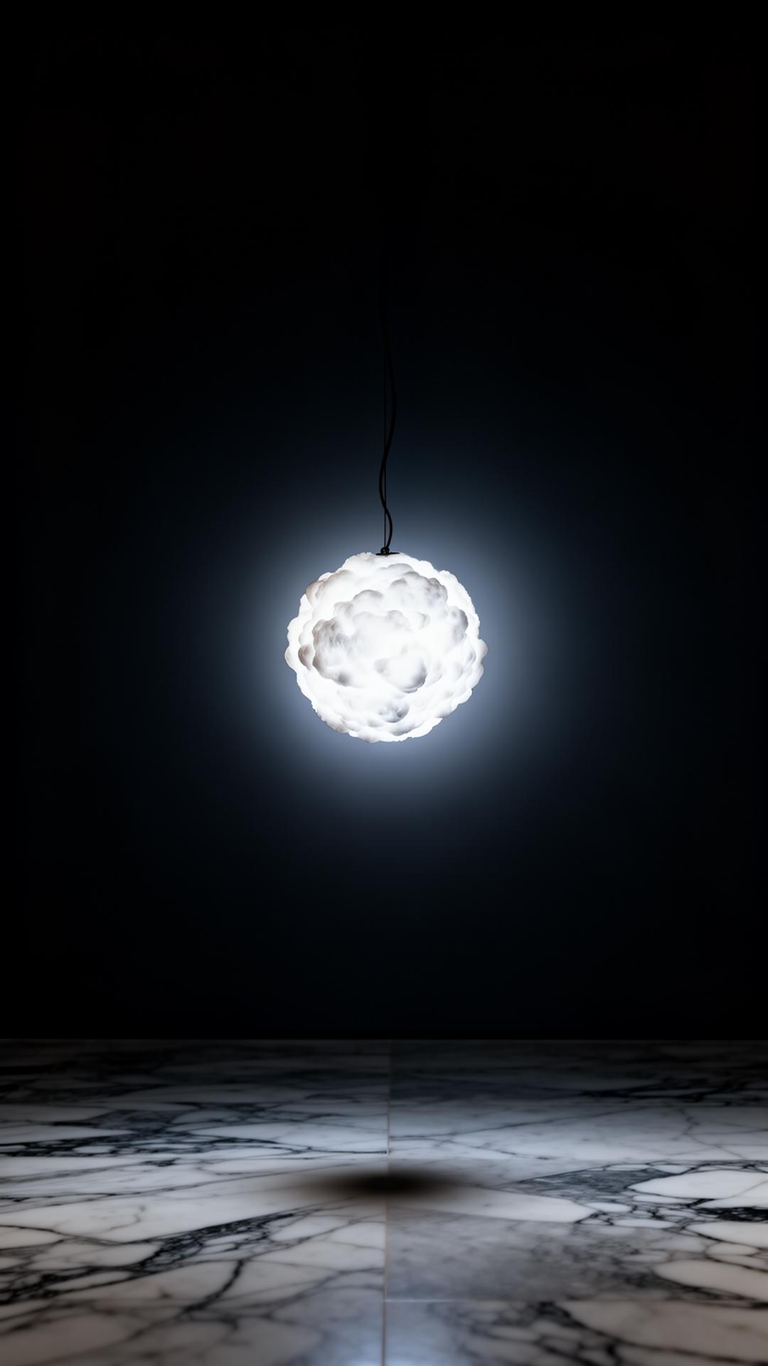 Suspended luminous form in gallery space